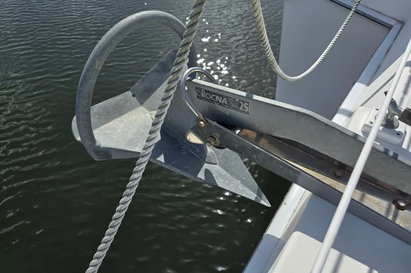 Slide: The Image of Anchor on Endeavour Trawler Cat 44, 2003 model, secured on deck by water. - 85