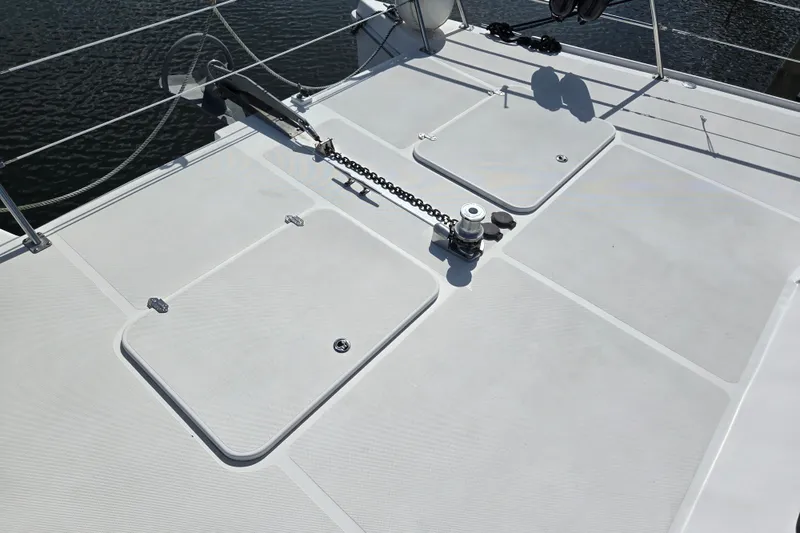 Slide: The Image of Deck of 2003 Endeavour Trawler Cat 44 with anchor chain and hatches. - 86