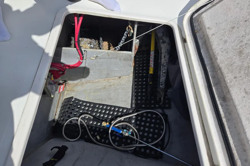 Slide: The Image of Open hatch of 2003 Endeavour Trawler Cat 44 showing anchor chain and wiring. - 88