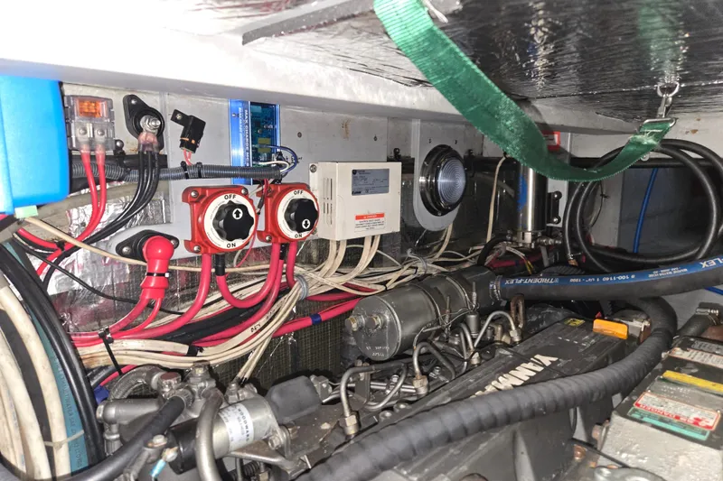 Slide: The Image of Engine room of a 2003 Endeavour Trawler Cat 44, showcasing wiring and mechanical components. - 96