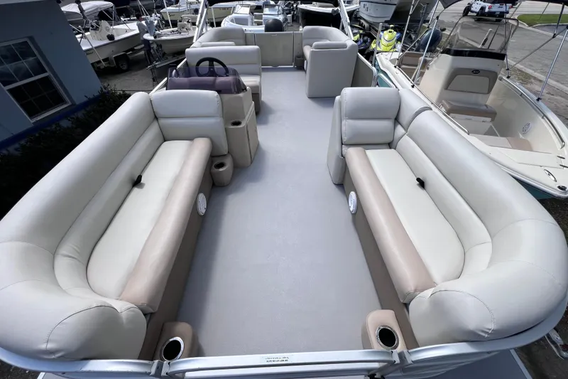 Slide: The Image of 2020 Godfrey Sweetwater 2286 Tritoon interior with spacious seating and modern design. - 10