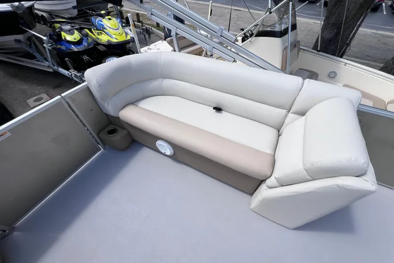 Slide: The Image of Luxurious seating on 2020 Godfrey Sweetwater 2286 Tritoon boat, featuring plush white upholstery. - 16