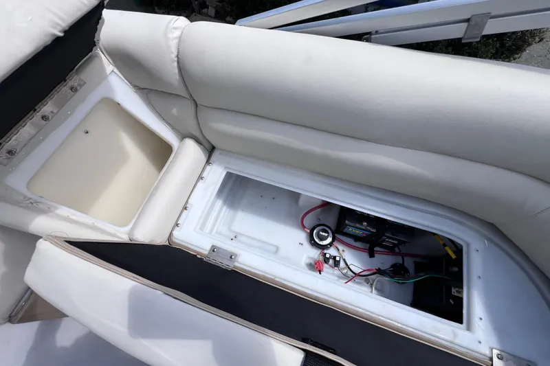 Slide: The Image of Interior view of a 2020 Godfrey Sweetwater 2286 Tritoon showing storage and battery compartment. - 17