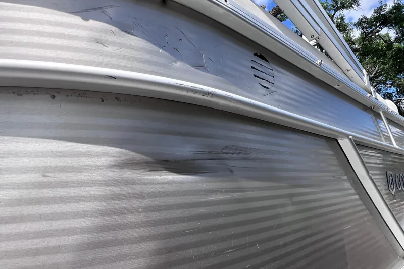 Slide: The Image of 2020 Godfrey Sweetwater 2286 Tritoon with visible exterior dents and scratches. - 25