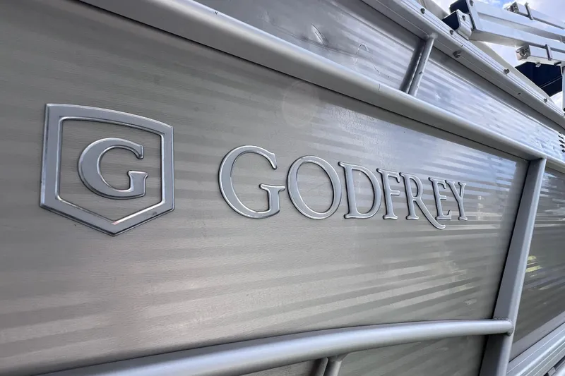 Slide: The Image of Close-up of 2020 Godfrey Sweetwater 2286 Tritoon logo on metallic surface. - 5