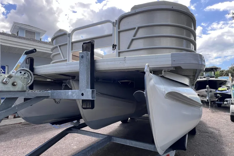 Slide: The Image of 2020 Godfrey Sweetwater 2286 Tritoon on trailer, showcasing pontoons and front deck. - 8