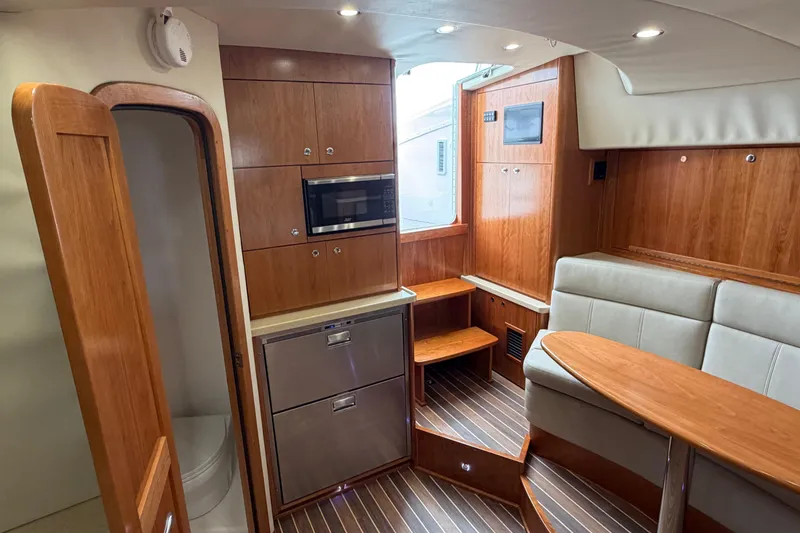 Slide: The Image of Interior of 2026 Albemarle 36 Express yacht with wood cabinetry and modern amenities. - 4