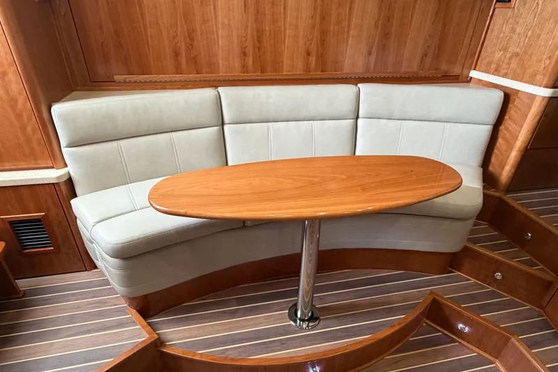 Slide: The Image of Luxurious interior of 2026 Albemarle 36 Express yacht with elegant seating and wooden table. - 6