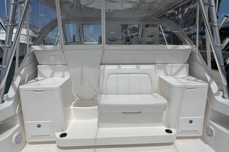 Slide: The Image of 2026 Albemarle 36 Express boat interior with white seating and storage compartments. - 9