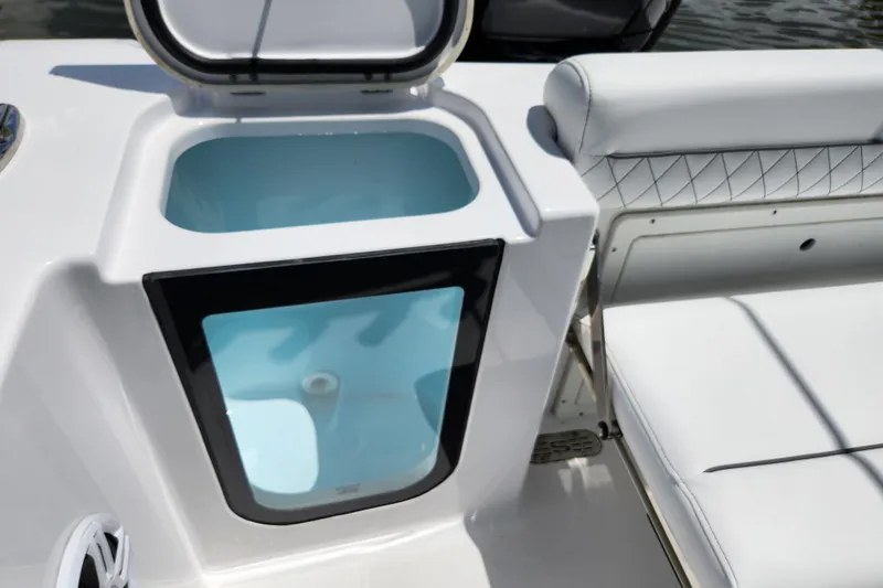 Slide: The Image of 2024 Sportsman Open 232 Center Console livewell and seating detail. - 16