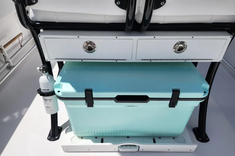 Slide: The Image of 2024 Sportsman Open 232 Center Console with storage drawers and cooler. - 24