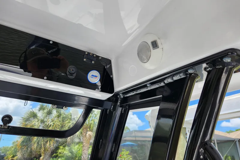 Slide: The Image of 2024 Sportsman Open 232 Center Console interior with speaker and control panel. - 34