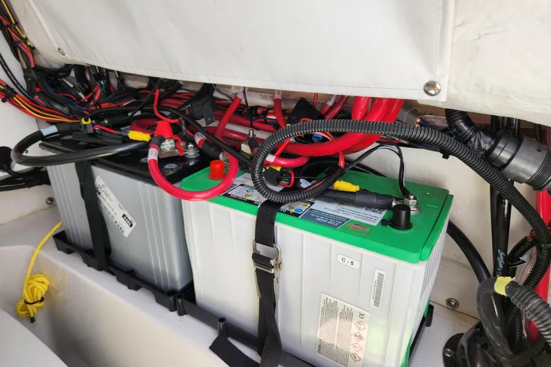 Slide: The Image of 2024 Sportsman Open 232 Center Console boat battery compartment with wiring. - 39