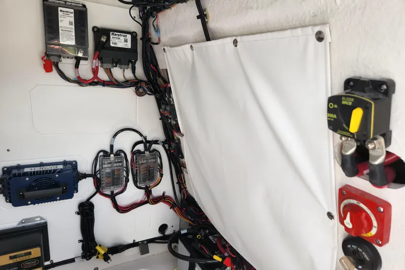 Slide: The Image of Electrical wiring and components inside a 2024 Sportsman Open 232 Center Console boat. - 41