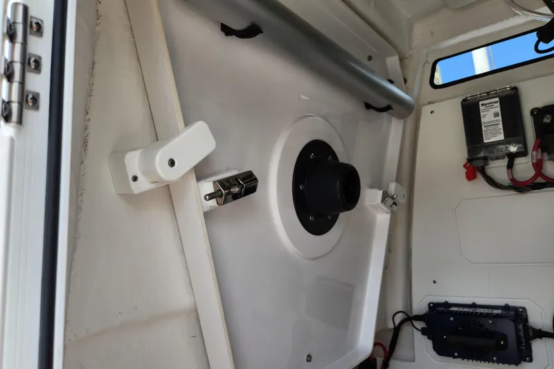 Slide: The Image of 2024 Sportsman Open 232 Center Console interior with electronic components and wiring. - 42