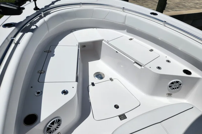 Slide: The Image of 2024 Sportsman Open 232 Center Console boat interior with seating and storage compartments. - 43
