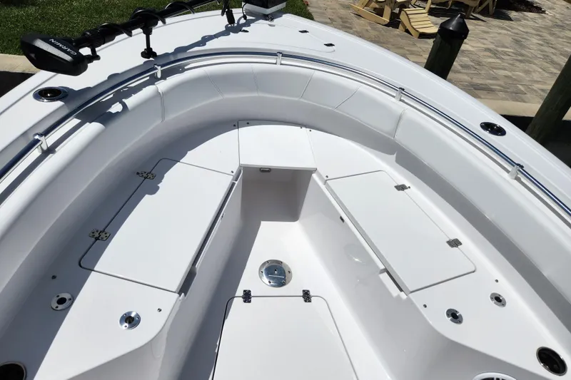 Slide: The Image of 2024 Sportsman Open 232 Center Console boat interior with seating and storage compartments. - 44