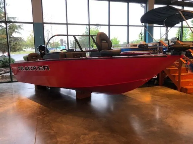 The Image of Red Tracker PRV 175CB boat, 2026 model, displayed in showroom. - 1