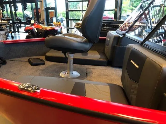 Slide: The Image of Interior of a 2026 Tracker PRV 175CB boat with red accents. - 16
