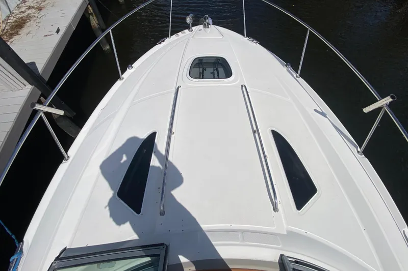 Slide: The Image of Bow view of 2007 Sea Ray Sundancer 310 yacht docked at marina. - 21