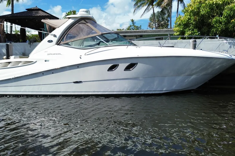 Slide: The Image of 2007 Sea Ray Sundancer 310 yacht docked by tropical waterfront. - 9
