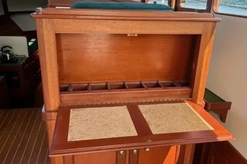 Slide: The Image of Wooden interior of 2003 Snug Harbor Shearwater boat with storage compartments. - 14