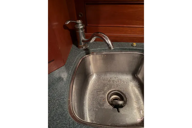 Slide: The Image of Stainless steel sink with faucet in Snug Harbor Shearwater 2003 model. - 21