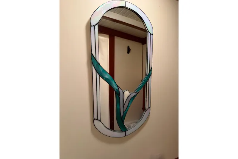 Slide: The Image of Stained glass mirror on Snug Harbor Shearwater 2003 boat interior wall. - 24