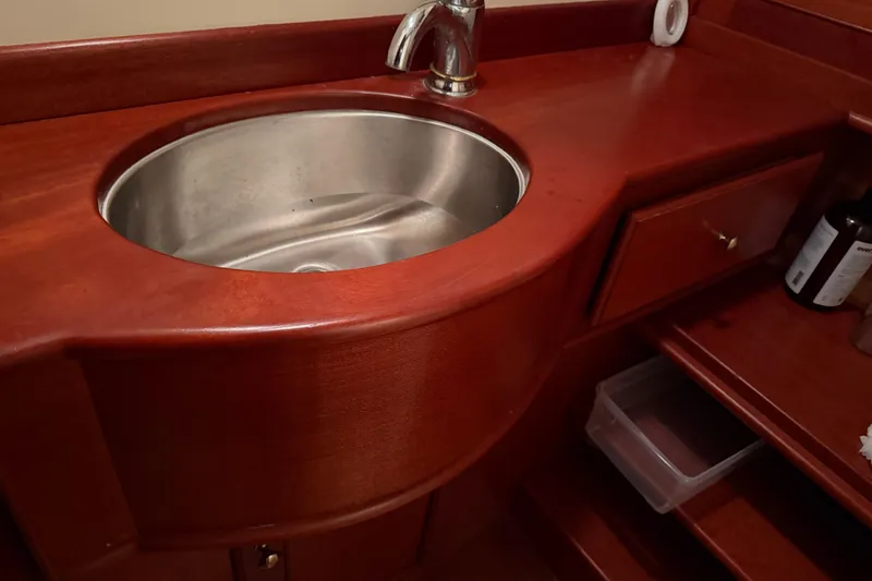 Slide: The Image of Wooden boat bathroom with stainless steel sink, Snug Harbor Shearwater 2003 model. - 25