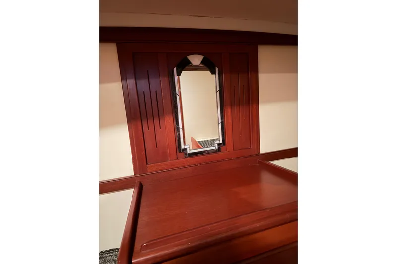 Slide: The Image of Interior of 2003 Snug Harbor Shearwater with elegant wood paneling and mirror. - 35