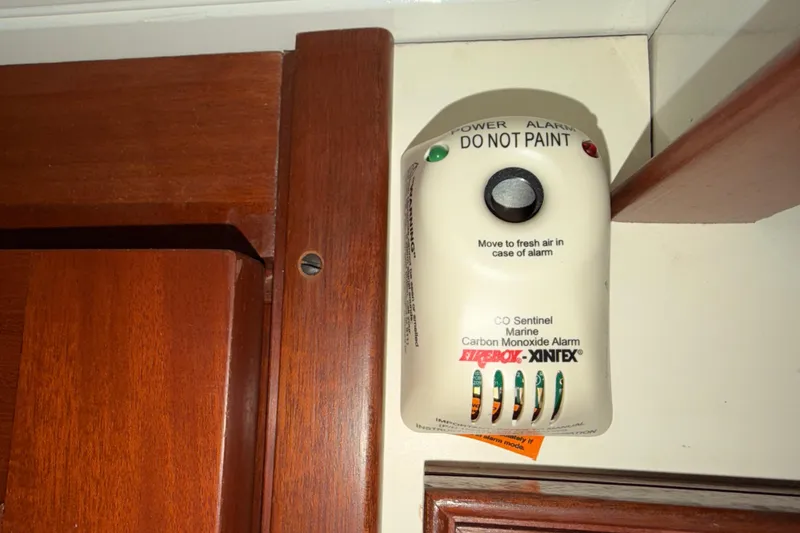 Slide: The Image of Carbon monoxide alarm on Snug Harbor Shearwater 2003 boat, mounted on wooden wall. - 36