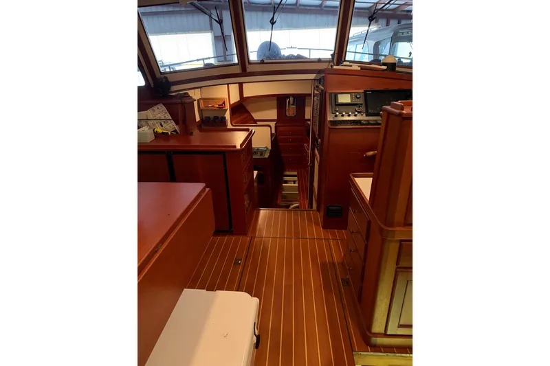 Slide: The Image of Interior of 2003 Snug Harbor Shearwater boat with wooden cabinetry and navigation equipment. - 9
