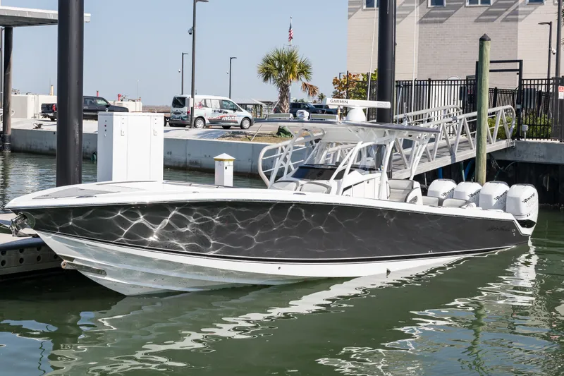 The Image of 2018 Nor-Tech 390 Sport Center Console boat docked at marina. - 0