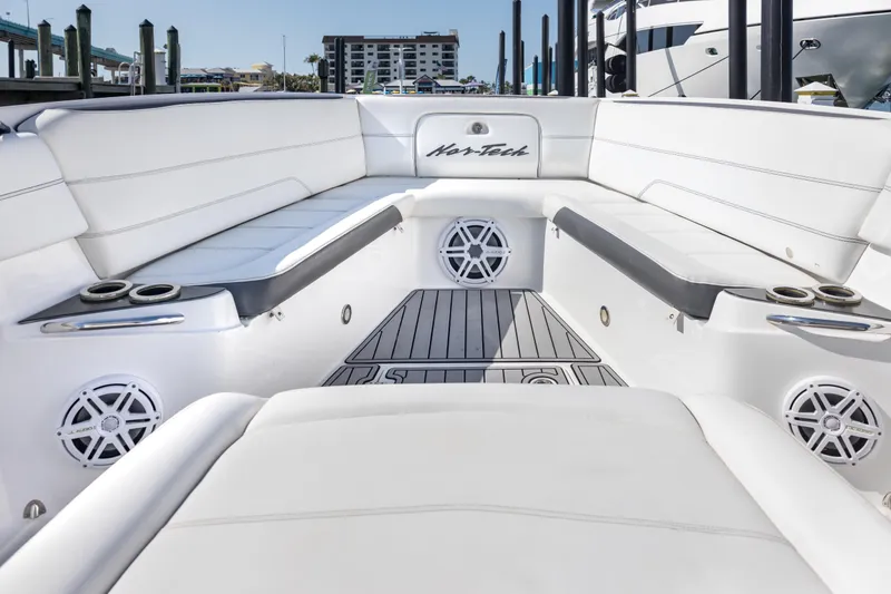 Slide: The Image of 2018 Nor-Tech 390 Sport Center Console interior with sleek seating and modern design. - 11