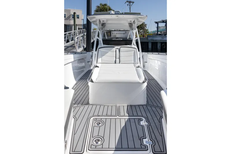 Slide: The Image of 2018 Nor-Tech 390 Sport Center Console boat with sleek deck and comfortable seating. - 13