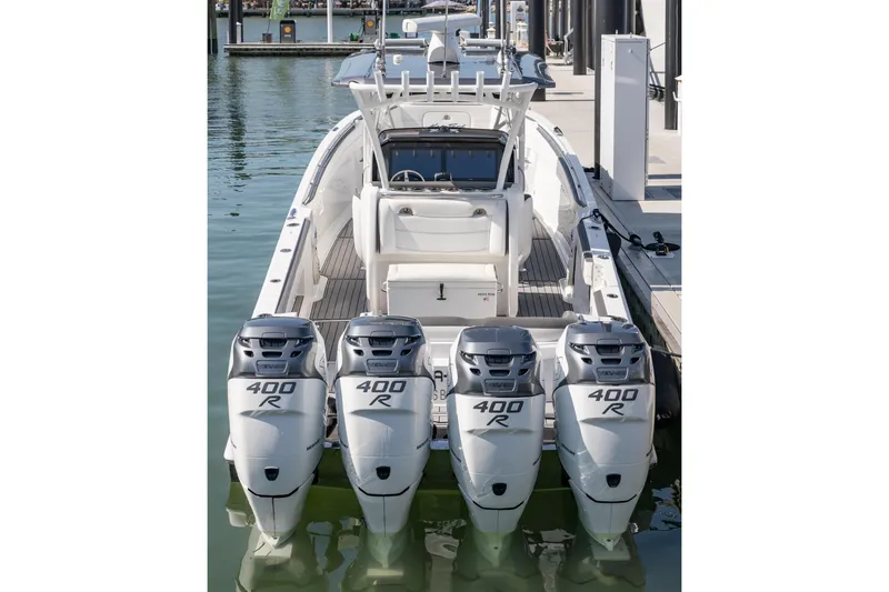 Slide: The Image of 2018 Nor-Tech 390 Sport Center Console with quad 400R engines docked at marina. - 2