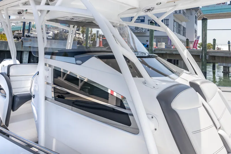 Slide: The Image of 2018 Nor-Tech 390 Sport Center Console boat interior with sleek design and modern features. - 25
