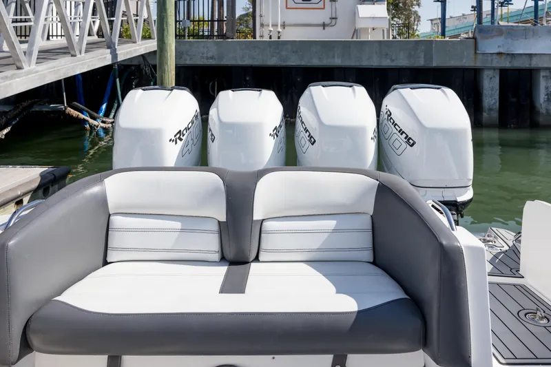 Slide: The Image of 2018 Nor-Tech 390 Sport Center Console with quad engines, docked at marina. - 4