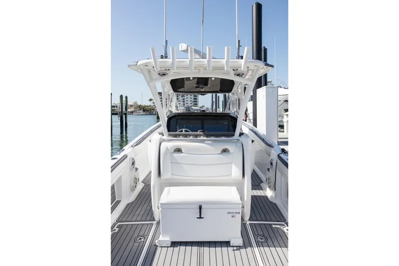 Slide: The Image of 2018 Nor-Tech 390 Sport Center Console boat interior with seating and helm station. - 8
