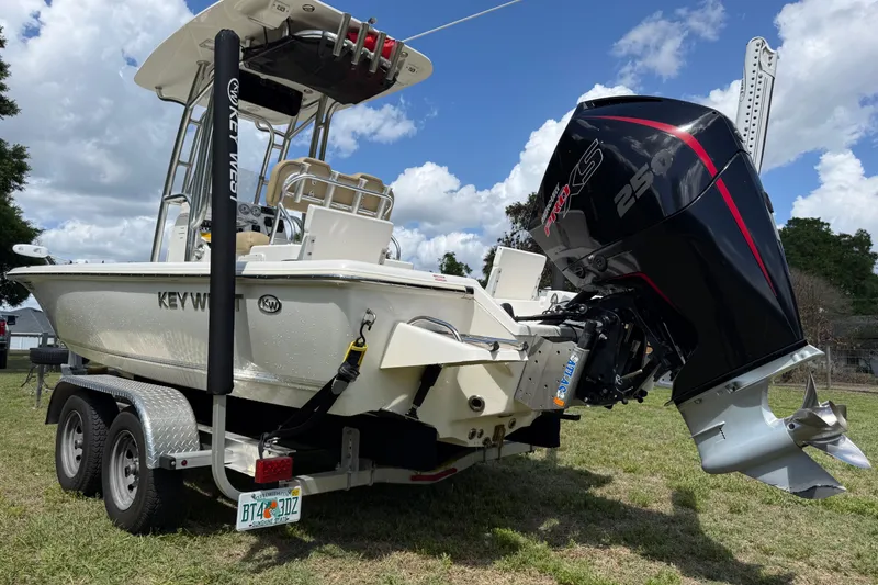Slide: The Image of 2020 Key West 230 Bay Reef boat on trailer with powerful outboard motor. - 10