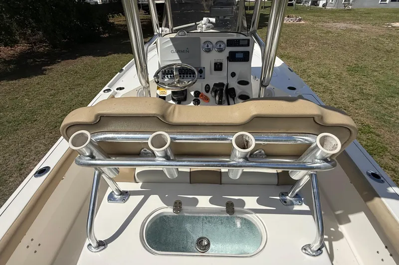 Slide: The Image of 2020 Key West 230 Bay Reef boat interior with helm, rod holders, and seating. - 19