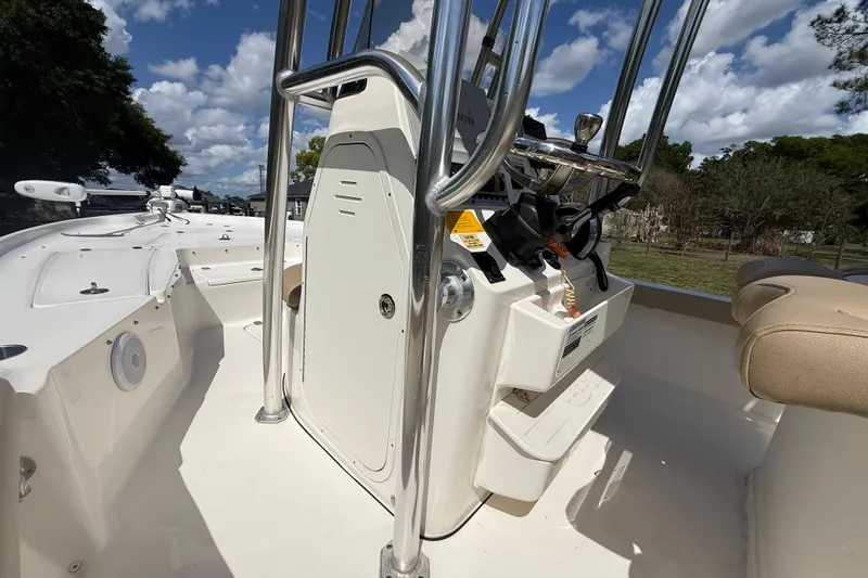 Slide: The Image of 2020 Key West 230 Bay Reef boat interior with steering console and seating. - 21