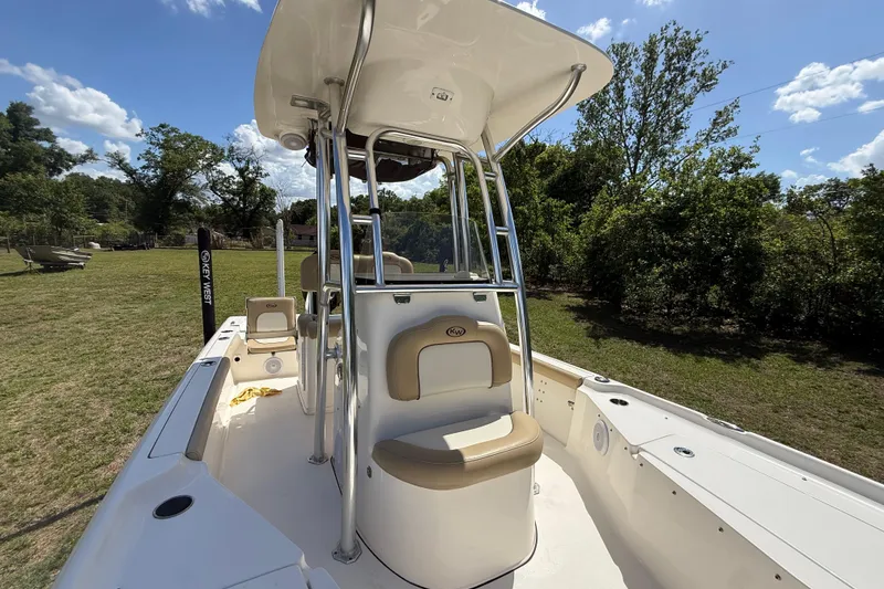 Slide: The Image of 2020 Key West 230 Bay Reef boat with T-top, beige seating, and open deck. - 22