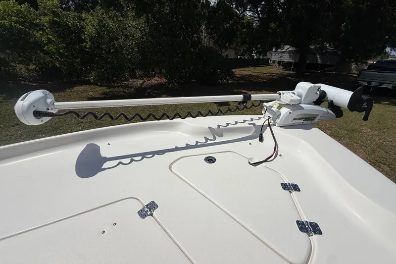 Slide: The Image of 2020 Key West 230 Bay Reef boat with mounted trolling motor on deck. - 25