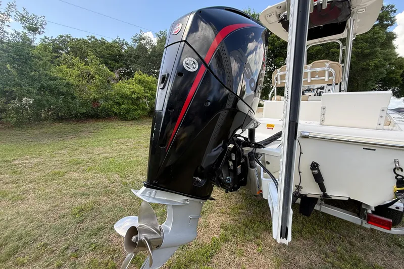 Slide: The Image of 2020 Key West 230 Bay Reef boat with powerful outboard motor on grassy area. - 30