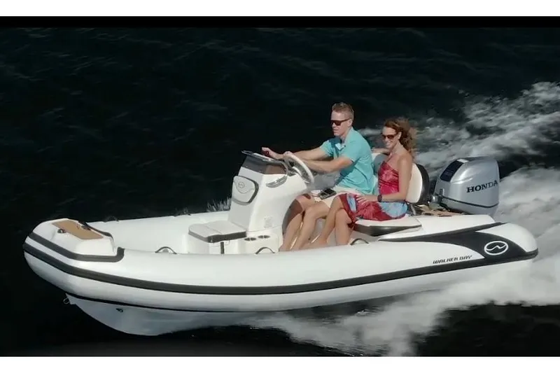 The Image of Manufacturer Provided Image: Walker Bay Generation 14 LTE 2025 boat cruising on water with two passengers. - 1