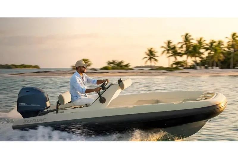 The Image of Manufacturer Provided Image: 2025 Zodiac Yachtline 4.0 cruising near tropical island at sunset. - 1