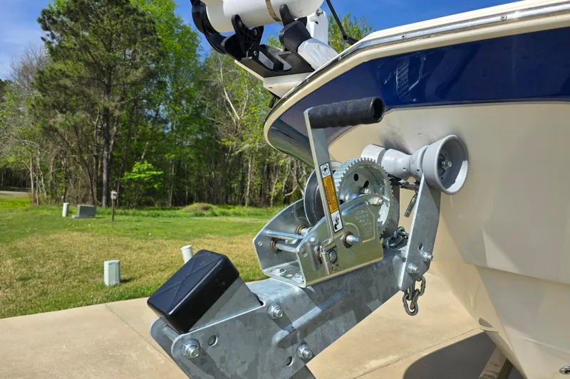 Slide: The Image of 2024 Carolina Skiff 24 Ultra Elite boat trailer winch in a scenic outdoor setting. - 12