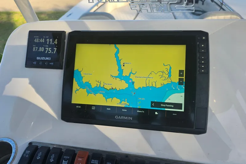 Slide: The Image of Garmin navigation system on 2024 Carolina Skiff 24 Ultra Elite boat dashboard. - 14