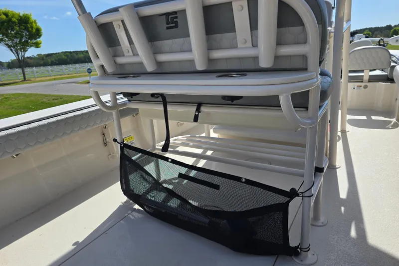 Slide: The Image of 2024 Carolina Skiff 24 Ultra Elite boat interior with seating and storage features. - 33